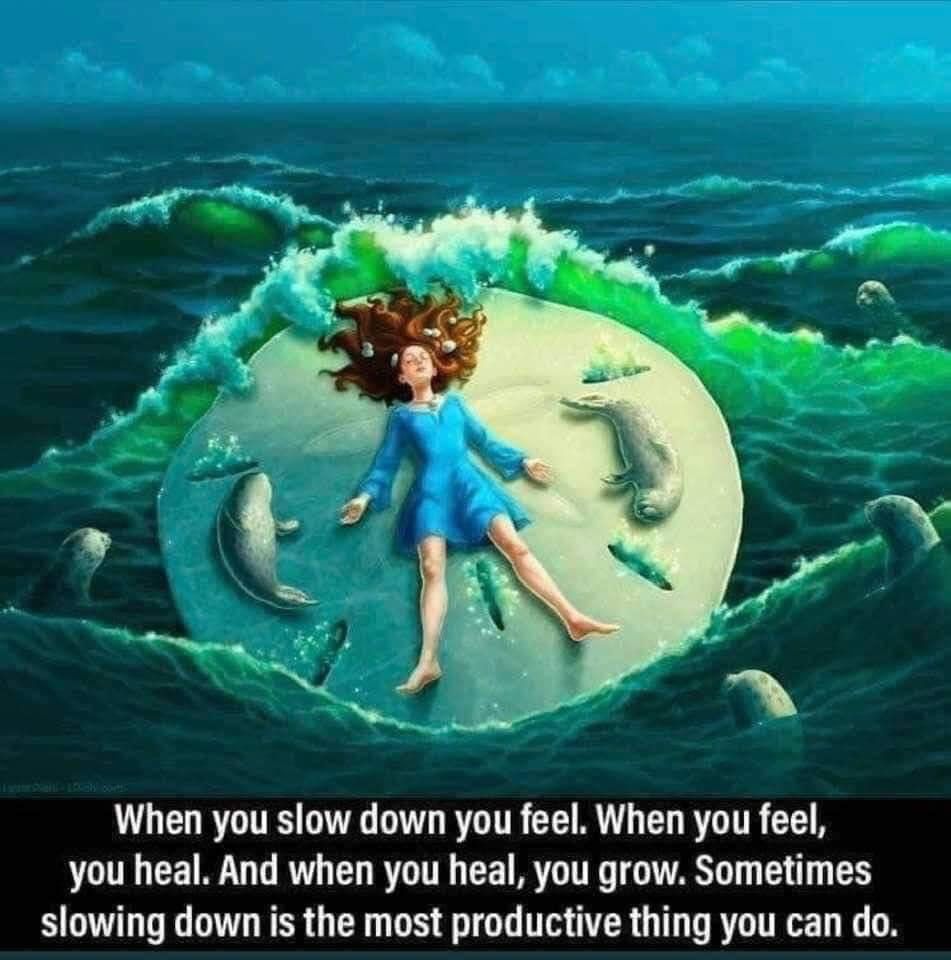 Woman laying in stillness with the dolphins and ocean waves — the healing power of slowing down, Earth Aya Energy