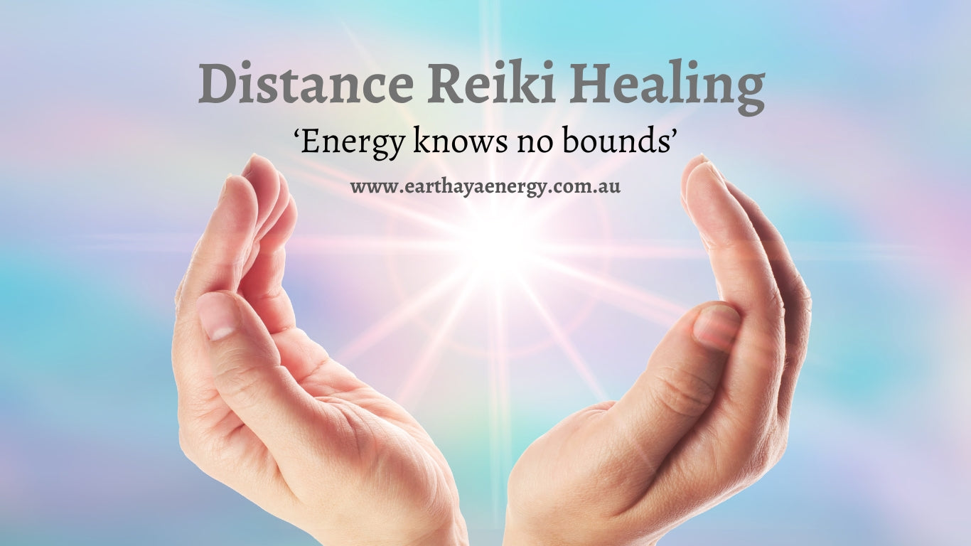 Hands sending Reiki healing energy across distance — distance Reiki explained by Earth Aya Energy