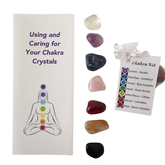 Chakra Healing Crystal Kit featuring 7 polished stones, a guidebook, and a storage pouch for energy balancing.