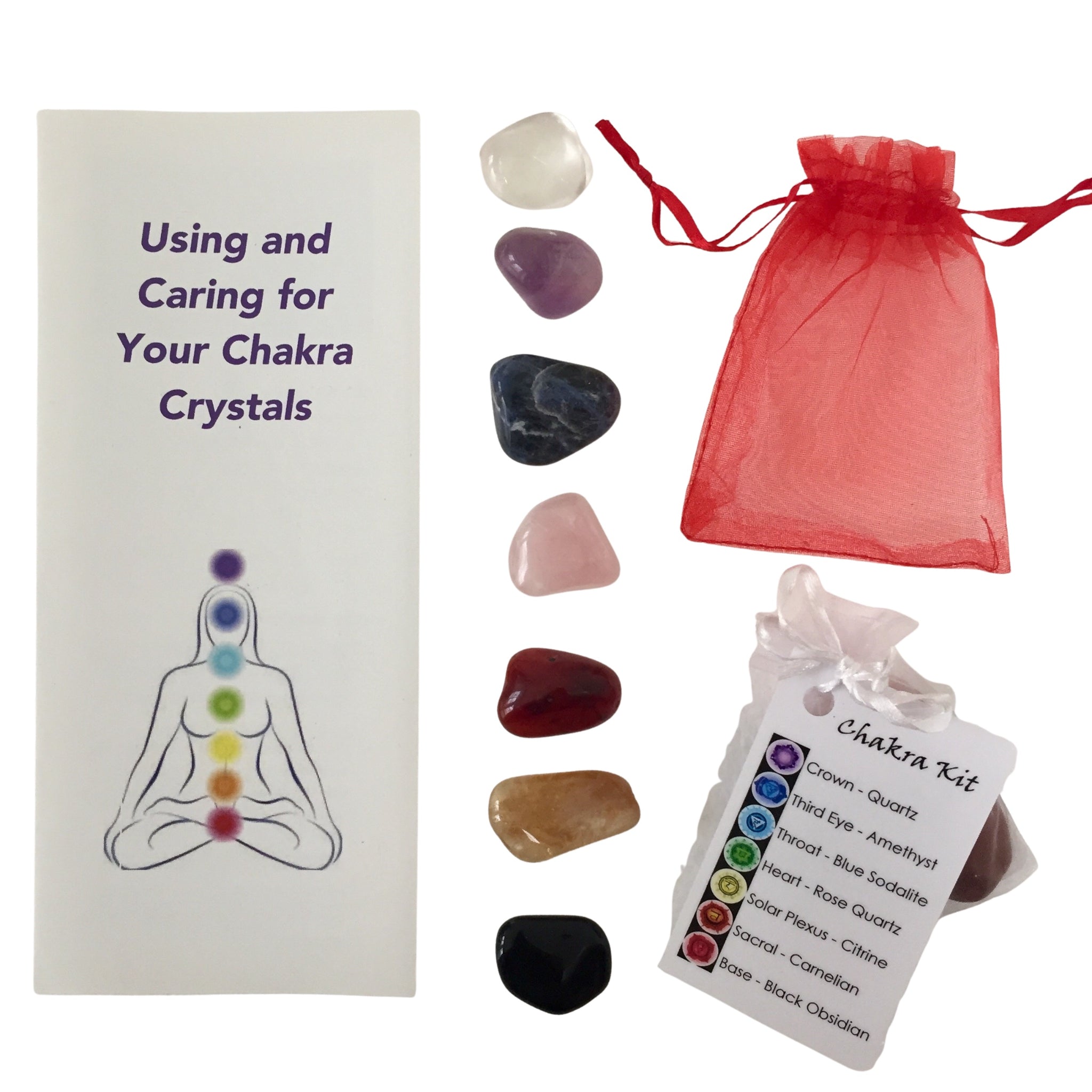 Complete Chakra Crystal Kit with tumbled stones, guidebook, and organza bag for energy healing.