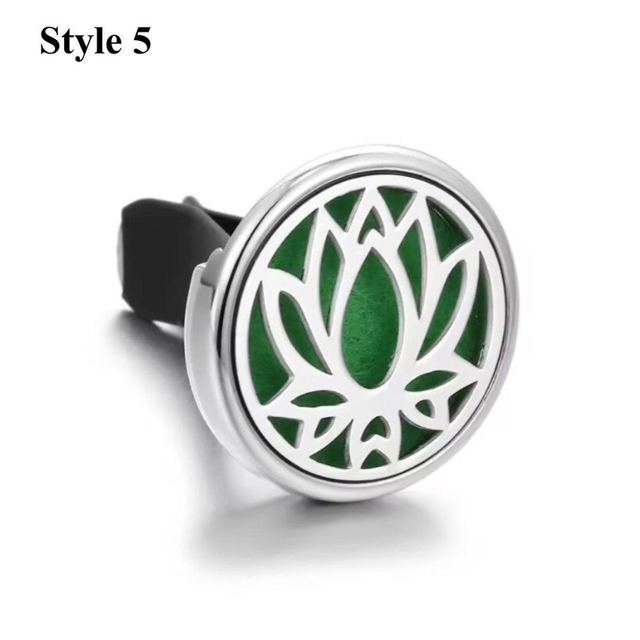 Lotus aromatherapy car diffuser in silver, designed with a geometric pattern to diffuse essential oils in your car.