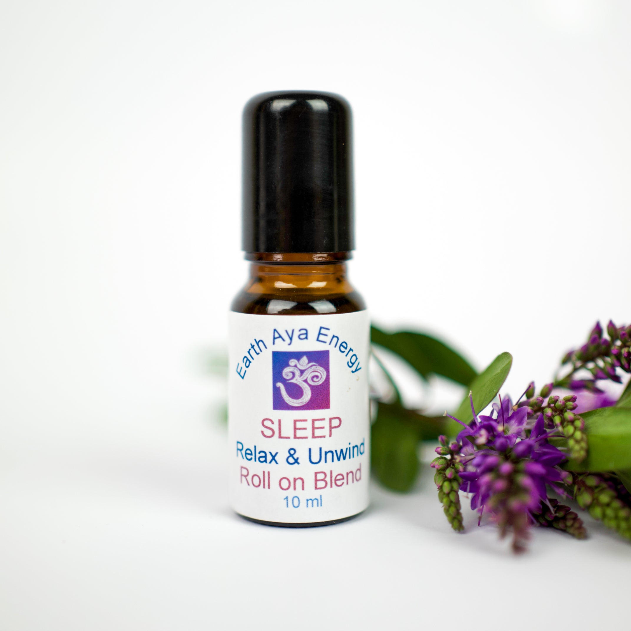 Reiki-infused SLEEP essential oil roll-on for relaxation & deep sleep support with crystals in a 10ml glass bottle.