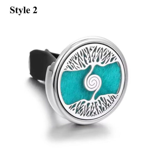 Swirling Tree of Life aromatherapy car diffuser in silver, featuring an artistic tree design for essential oil diffusion.