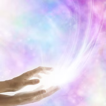 Hands radiating healing energy representing distance Reiki healing sessions with Earth Aya Energy, Healesville