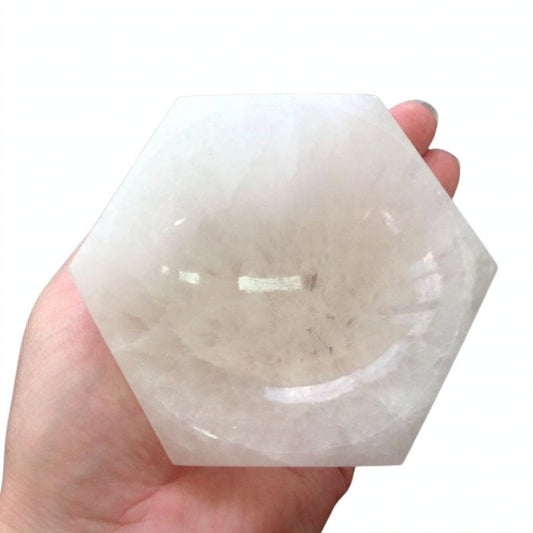 hand-carved hexagonal Selenite bowl, showcasing its smooth, luminous finish.
