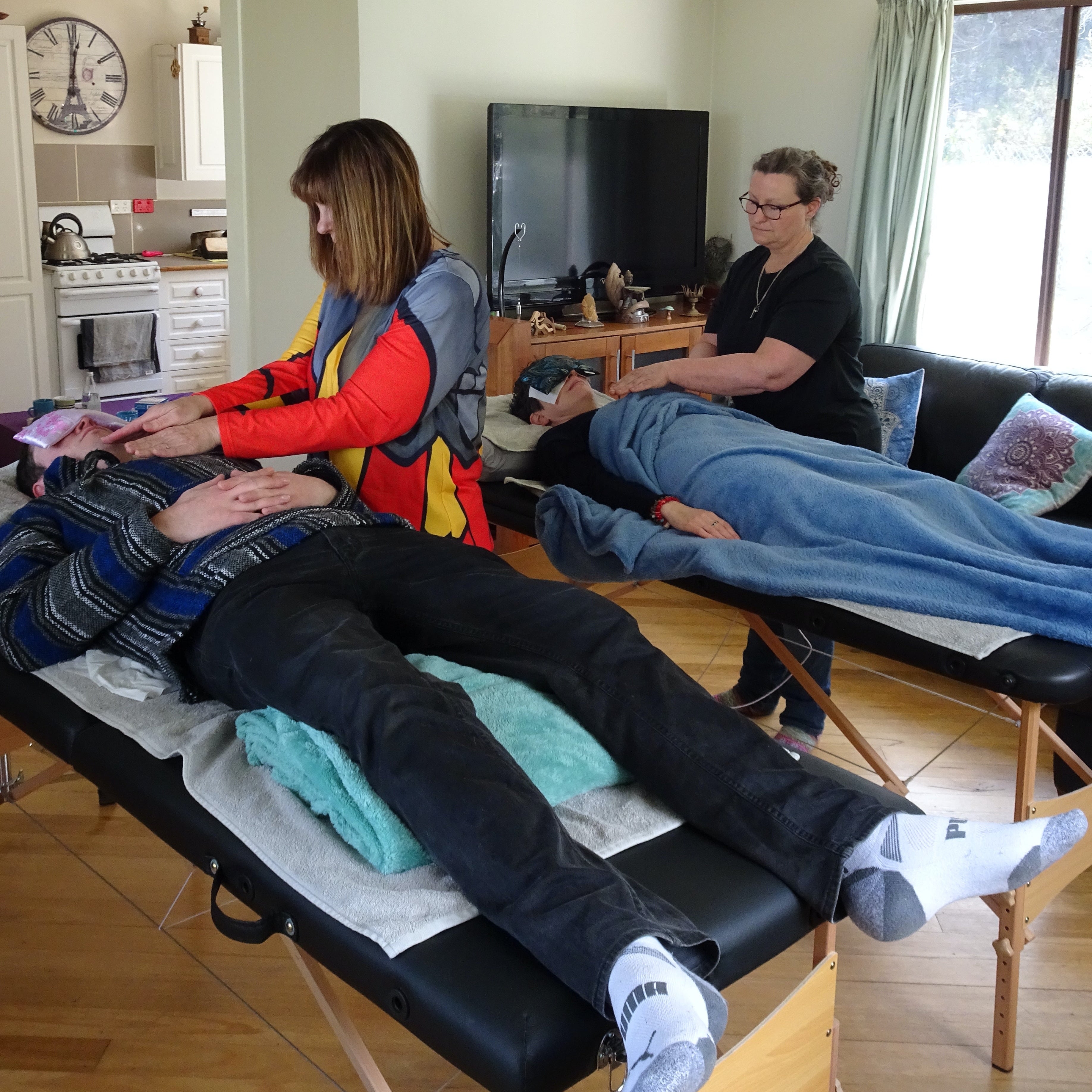 Reiki students practicing hands-on healing during a Reiki Share class in Healesville, Yarra Valley — Earth Aya Energy